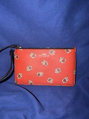 Coach Orange Floral Wristlet with Black Strap